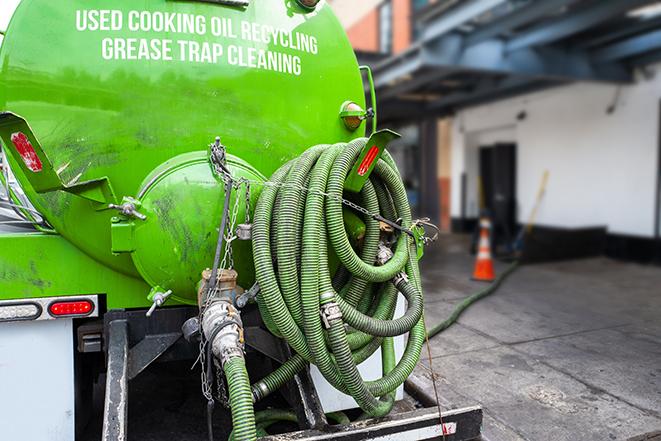 pump truck removing waste from a grease trap in Avenal CA